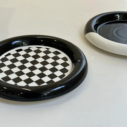 TWO BLACK AND WHITE PLATES 