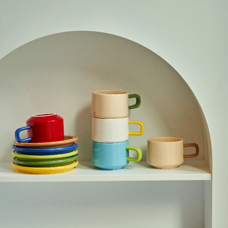 COLOURFUL MUGS AND TRAYS ON DISPLAY