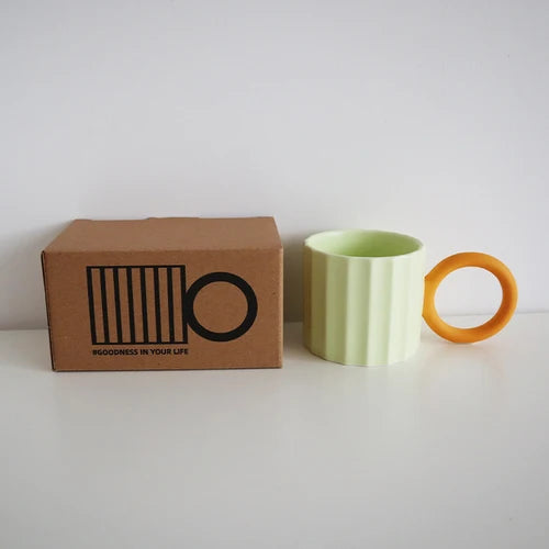 MELON MUG WITH A BIG CIRCLE ORANGE HANDLE AND A BOX